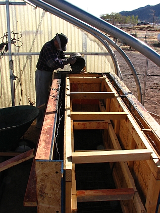 Pouring first section of greenhouse tank